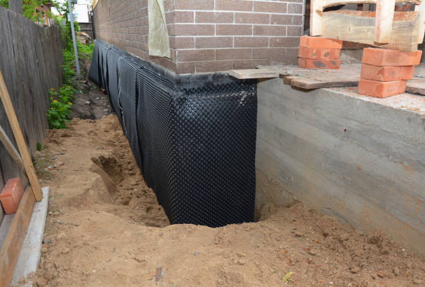 Happy homeowners after waterproofing job in Branch